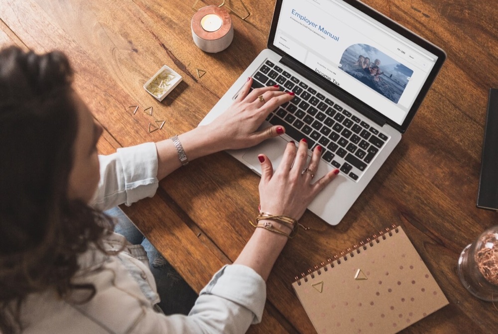 CAAT Employer Manual — desktop view on laptop